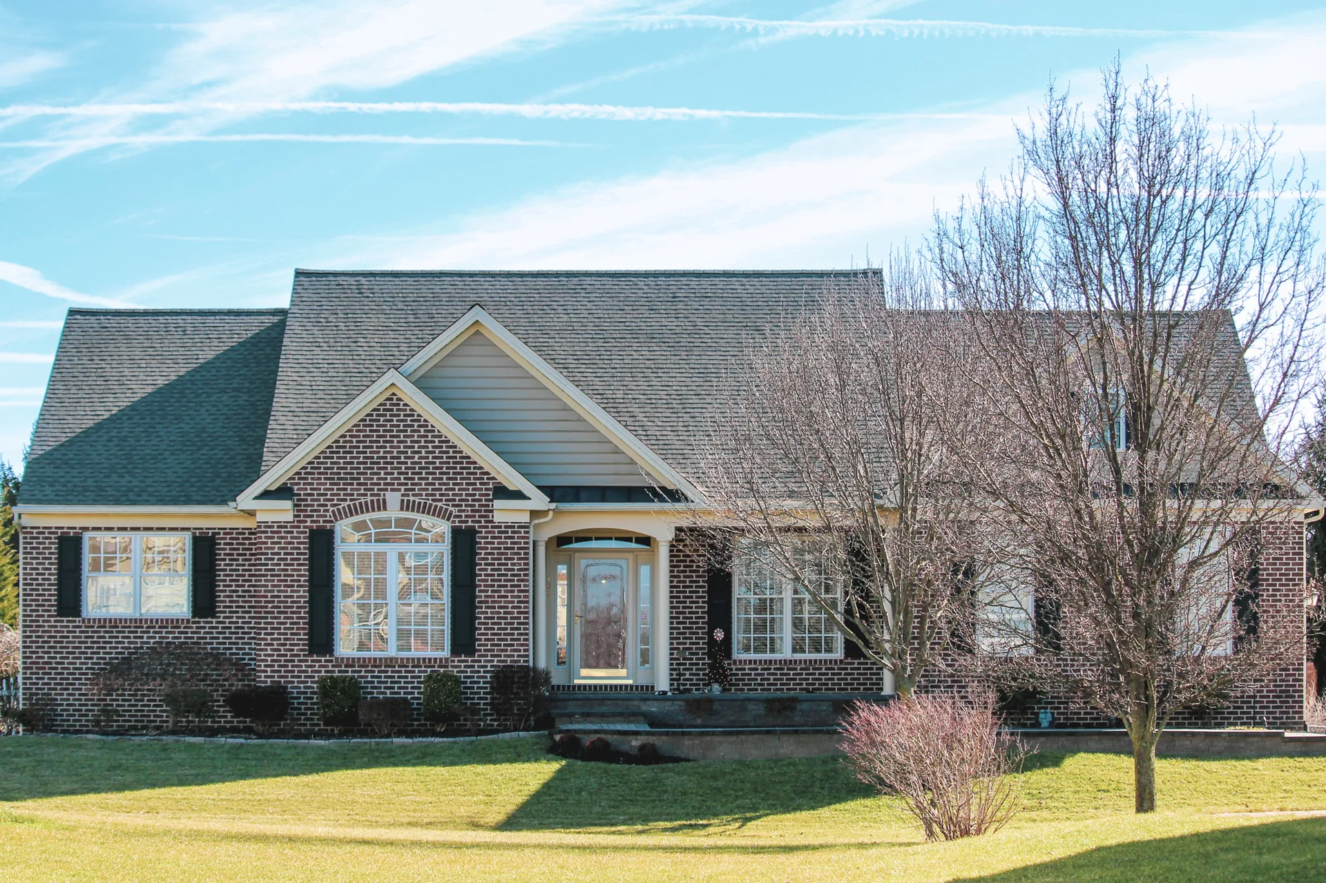 Completed hip-roof replacement on a brick ranch in York County, PA by Cool Water Roofing