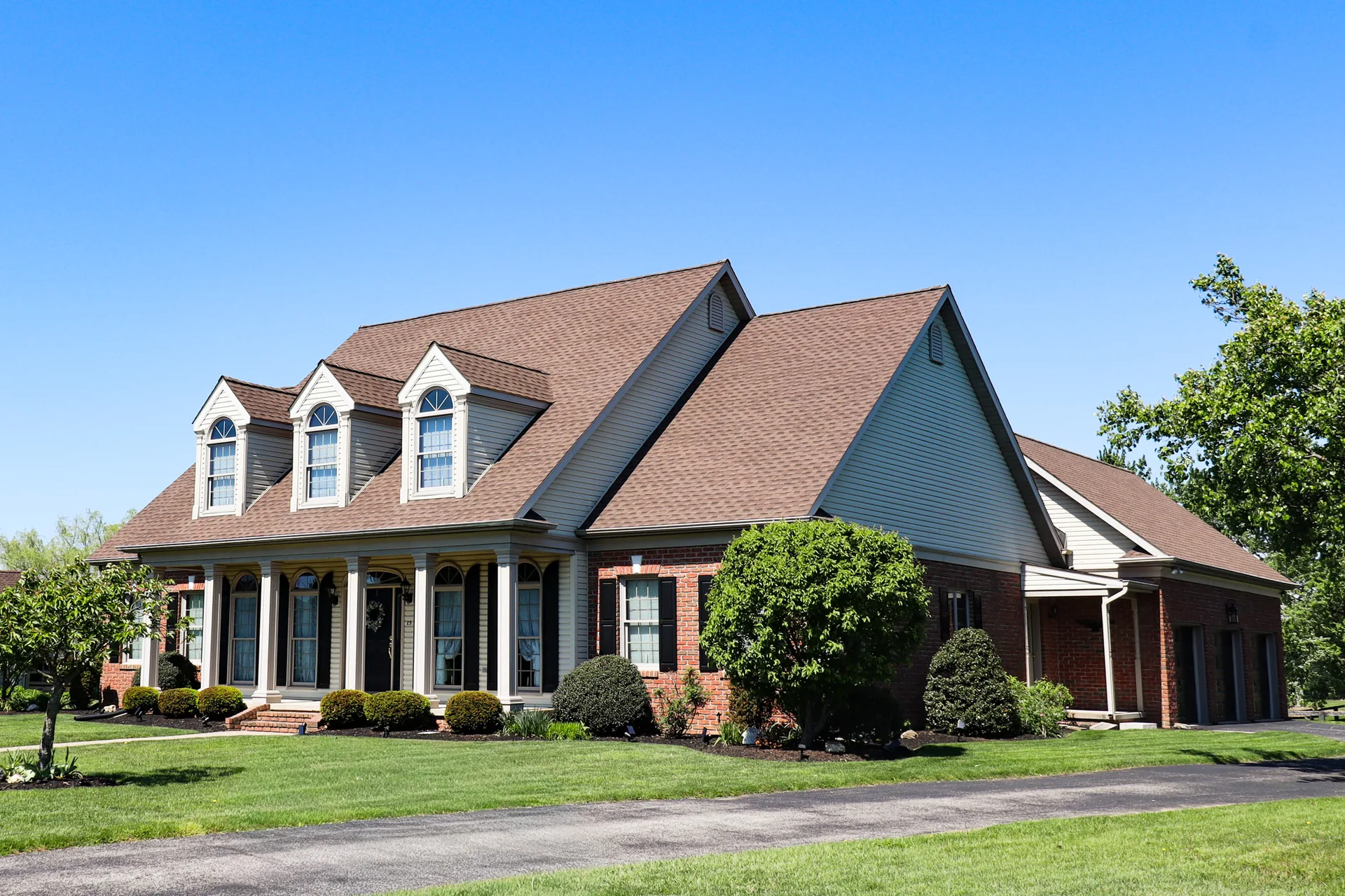 Completed roof on a Cape Cod home with three dormers in York County, PA by Cool Water Roofing