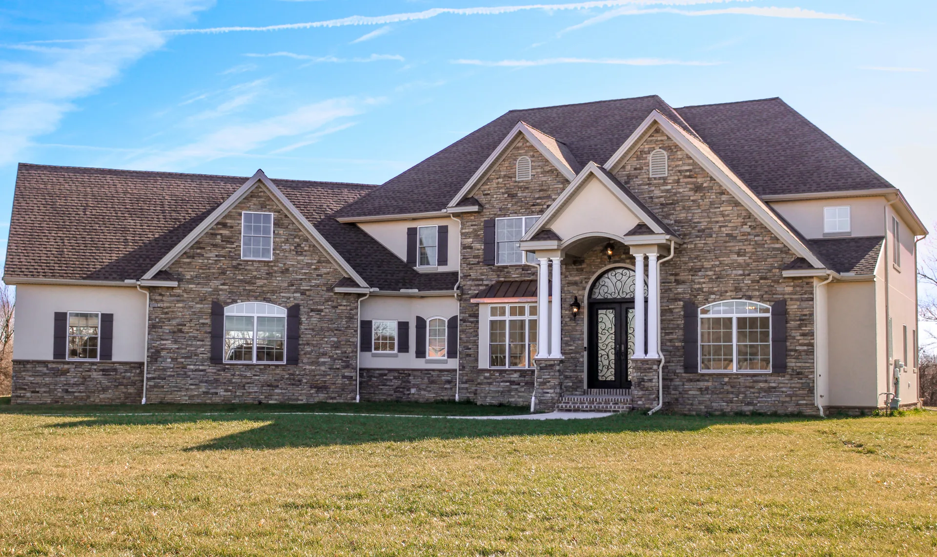 Completed roof on a stone-and-stucco home in York County, PA by Cool Water Roofing