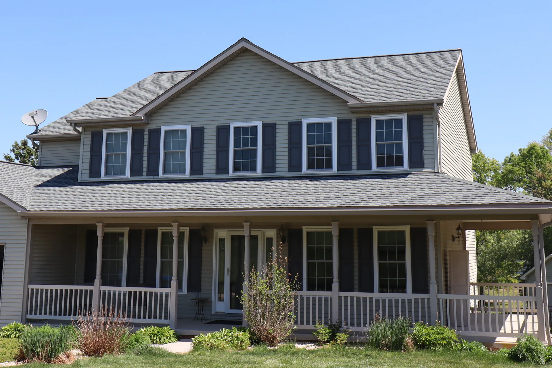 Completed roof on a wrap-porch colonial in York County, PA by Cool Water Roofing
